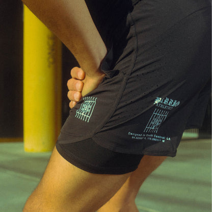 “INSPIRE THE STREETS” 2-IN-1 RUNNING SHORTS